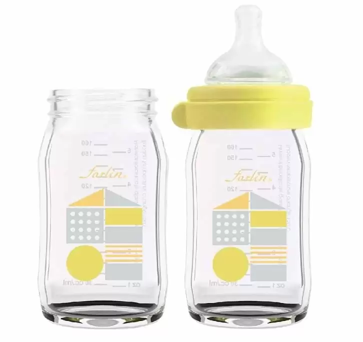 A yellow glass and silicon baby bottle, produced by FARLIN